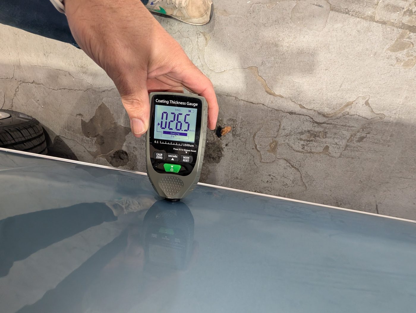 Paint thickness gauge checking for original paint and hidden bodywork on a classic Chevelle SS