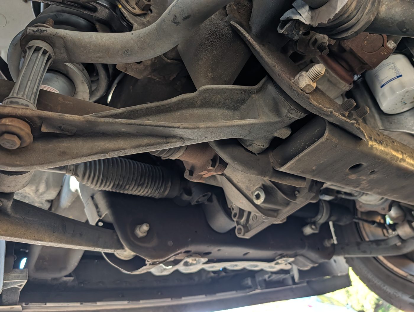 Truck frame, steering rack, and front suspension inspected from underneath