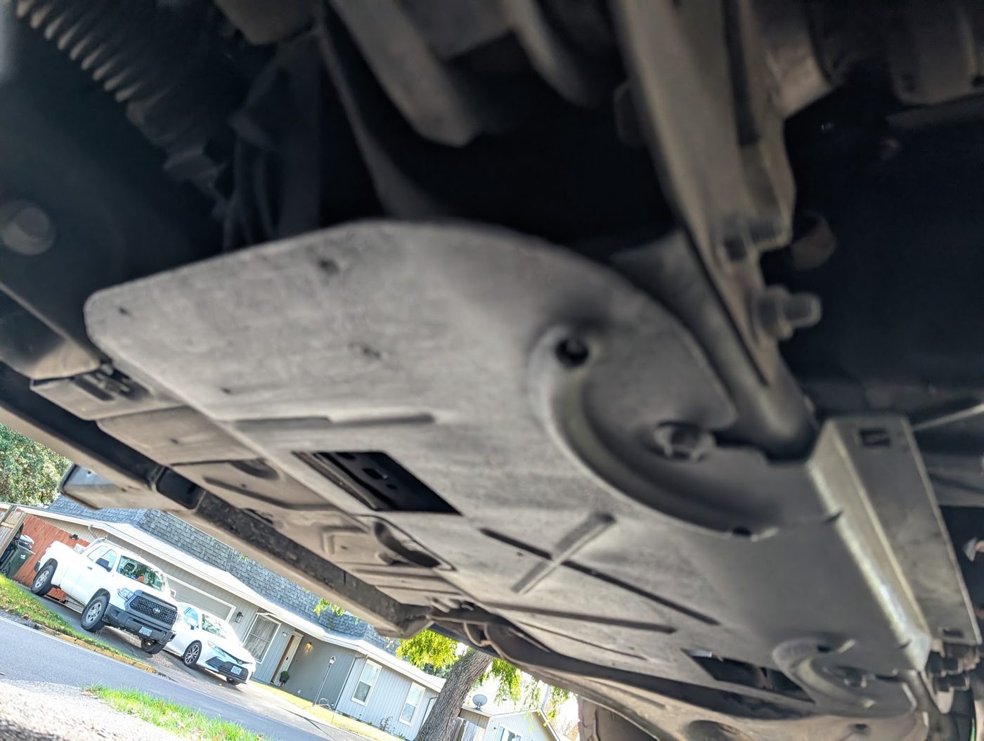 Underbody skid plate and drivetrain protection checked during a heavy-duty inspection