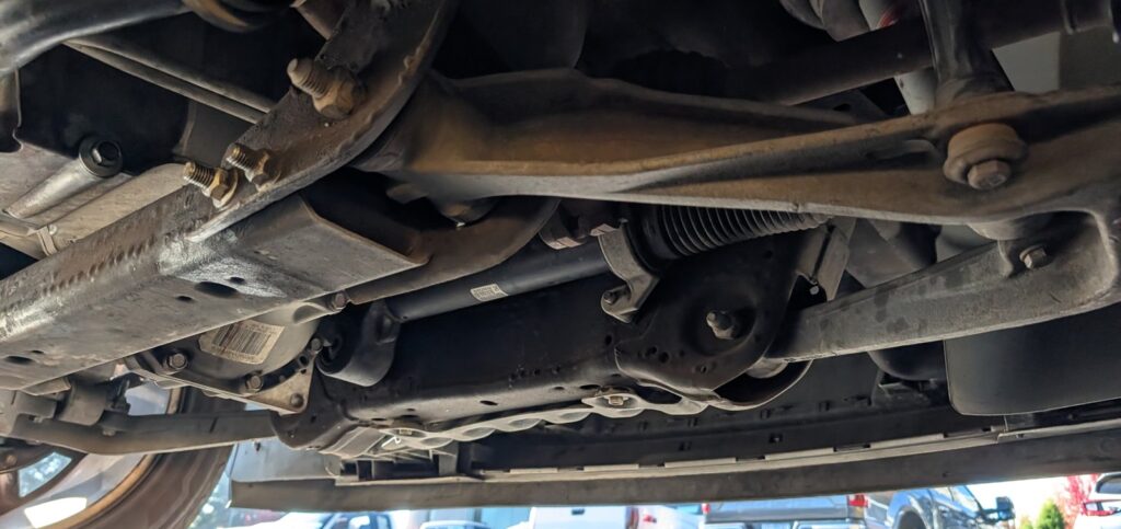 Undercarriage inspection during a pre-purchase vehicle inspection in Oregon