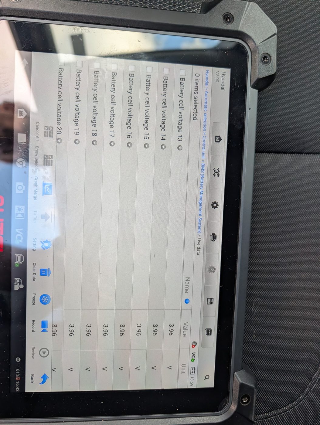 Full-system diagnostic scan results reviewed during a hybrid vehicle inspection