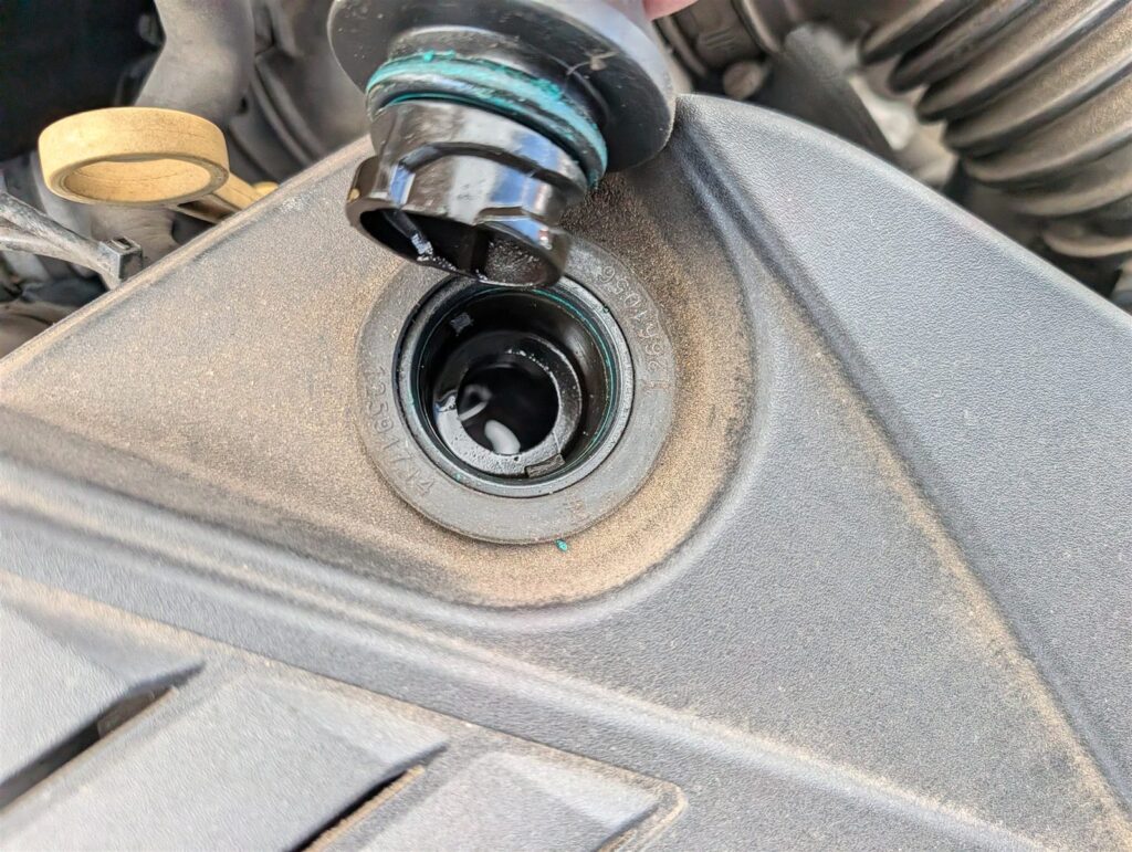 Oil filler and valve cover detail documented in a pre-purchase inspection report