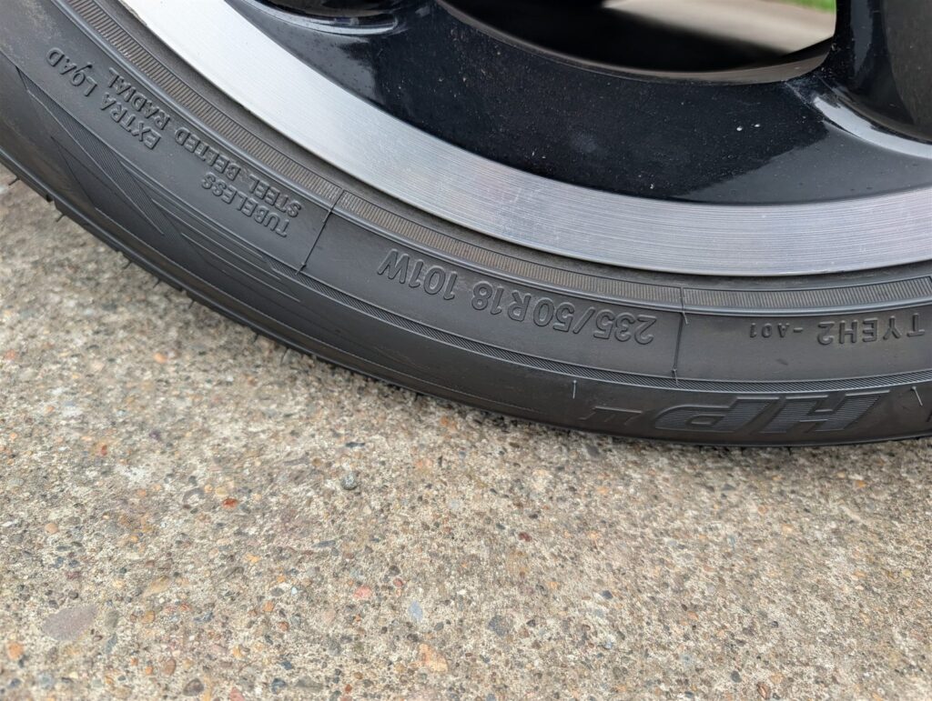 Tire sidewall and tread detail photographed for an inspection report