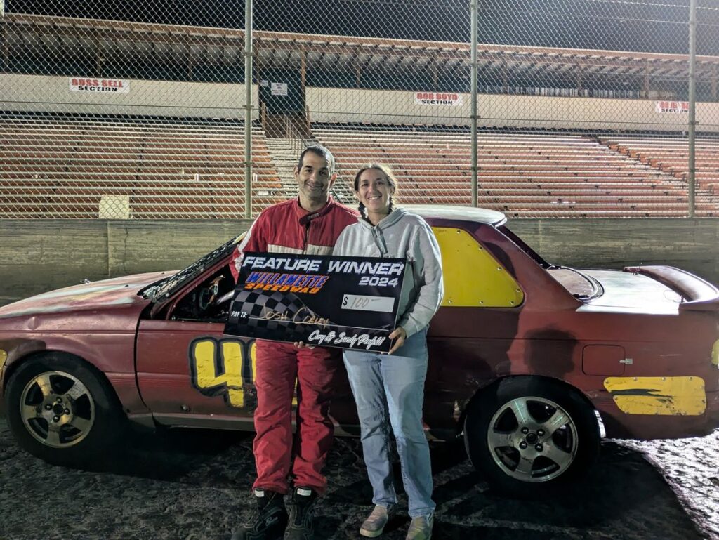 Josh Corley, owner of Precision Auto Inspect, with his wife Raven after a feature win at Willamette Speedway