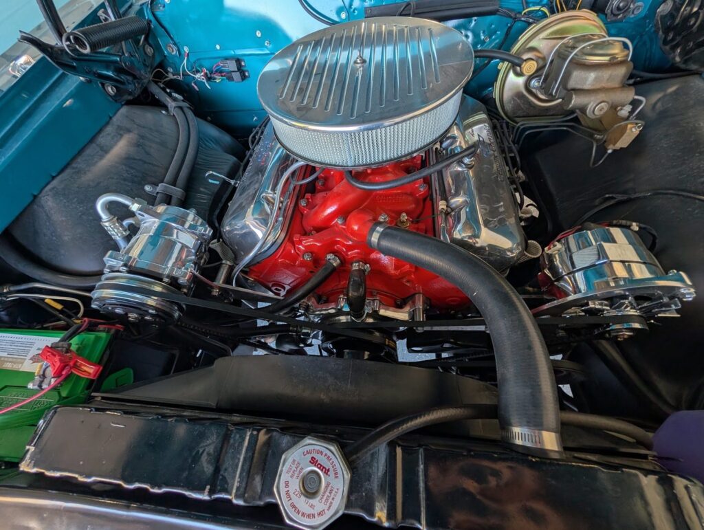 Big-block V8 engine bay with chrome air cleaner during a pre-purchase inspection in Medford, Oregon