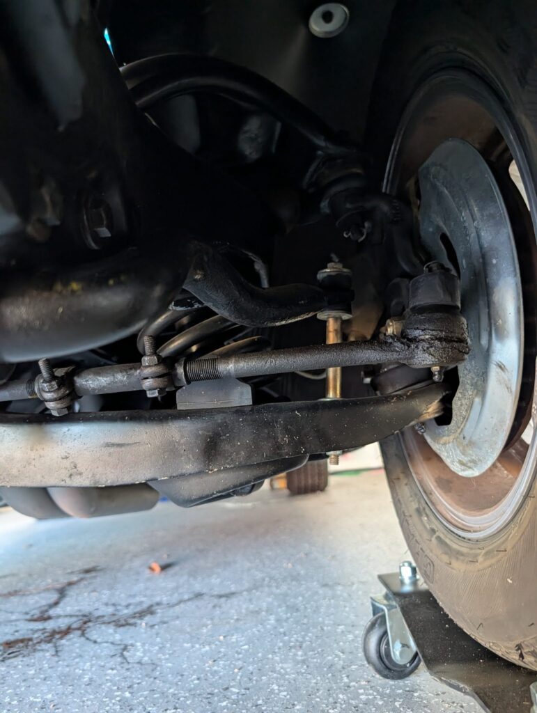 Front brake disc and steering components inspected during a vehicle inspection in Salem, Oregon