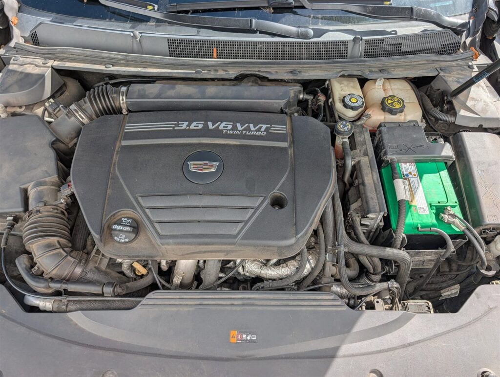 Cadillac V6 engine bay inspected for leaks and fluid condition during a Salem pre-purchase inspection