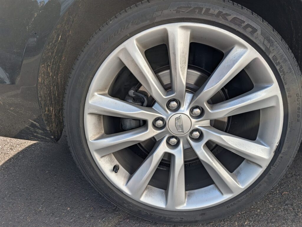 Wheel, tire, and brake checked during a TNC inspection for Uber and Lyft drivers in Oregon