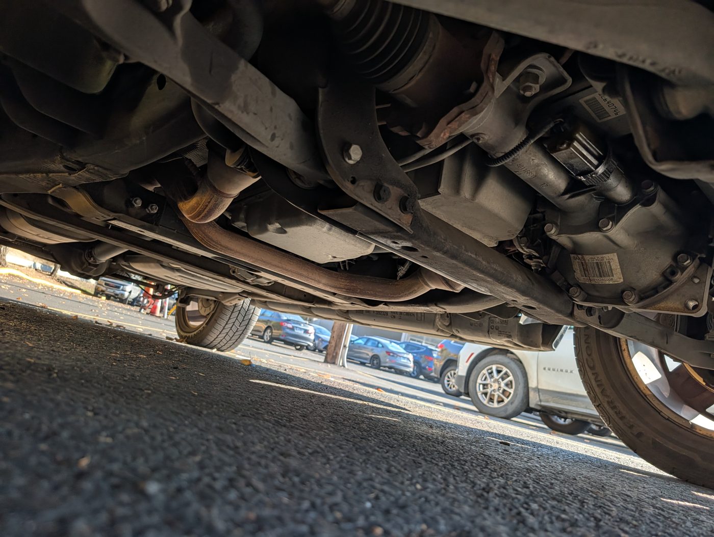 Undercarriage inspection checking for leaks and wear before warranty expiry