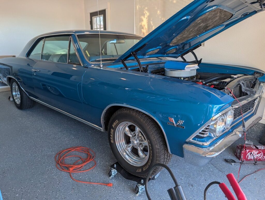 Classic Chevelle SS with its hood open during a full pre-purchase inspection